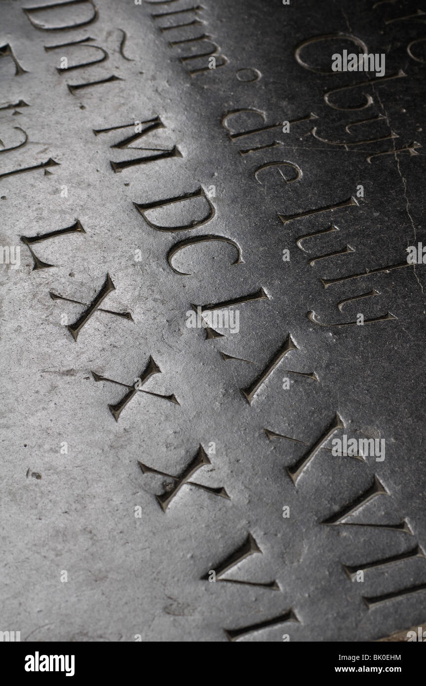 Roman numerals on memorial in St. Peter`s Church, Kineton, Warwickshire, England, UK Stock Photo